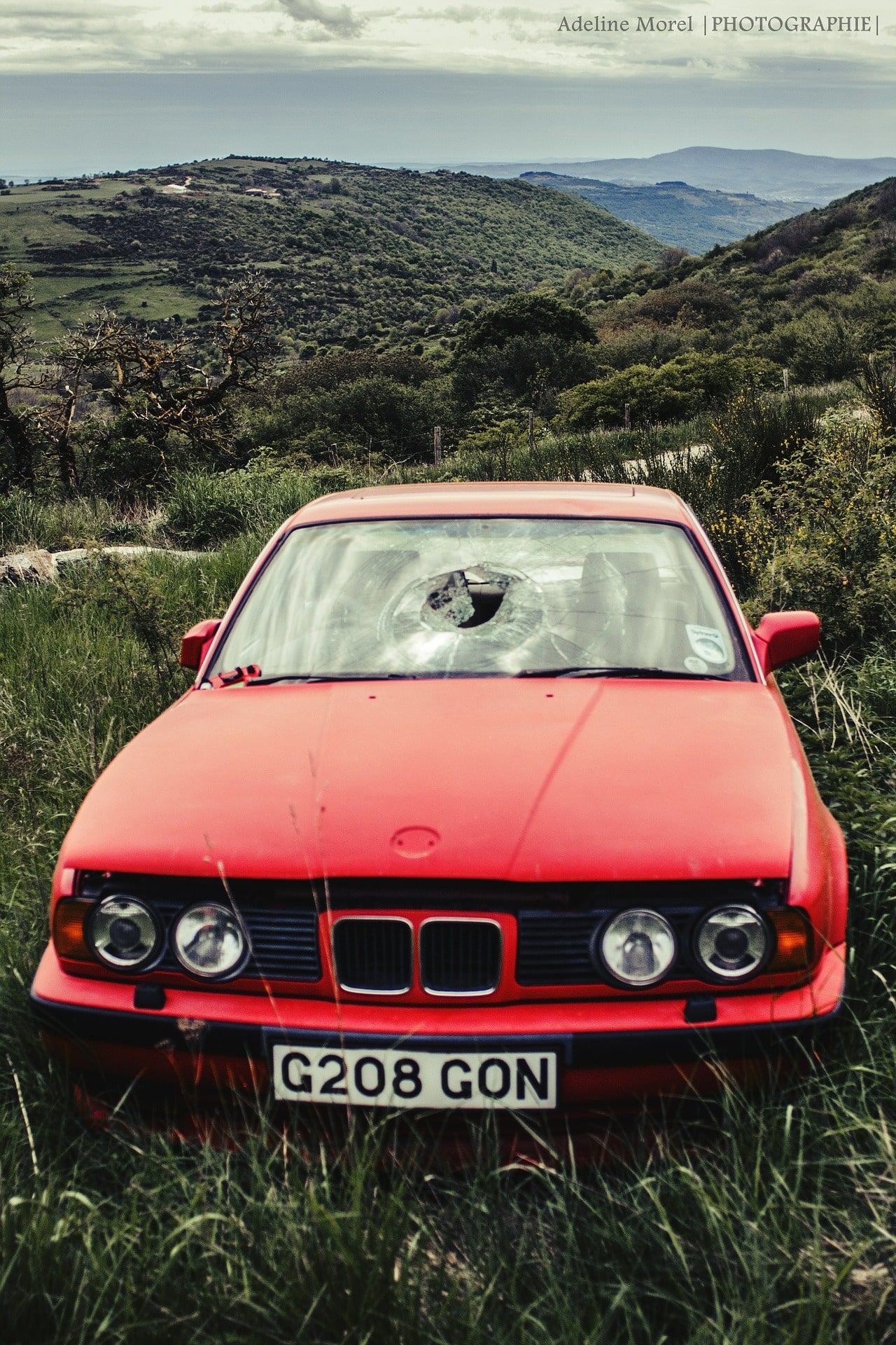 Red bmw broken windshield