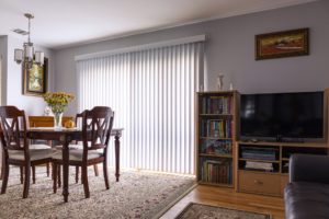 Interior of home with a blind covered patio door.