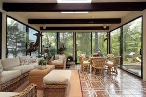 Sunroom in luxury home with patterned tile