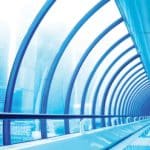 large bent glass wall structure on building