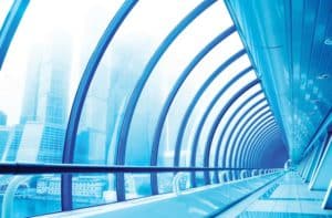 large bent glass wall structure on building