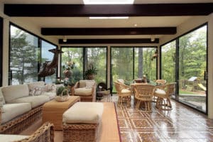 Sunroom in luxury home with patterned tile