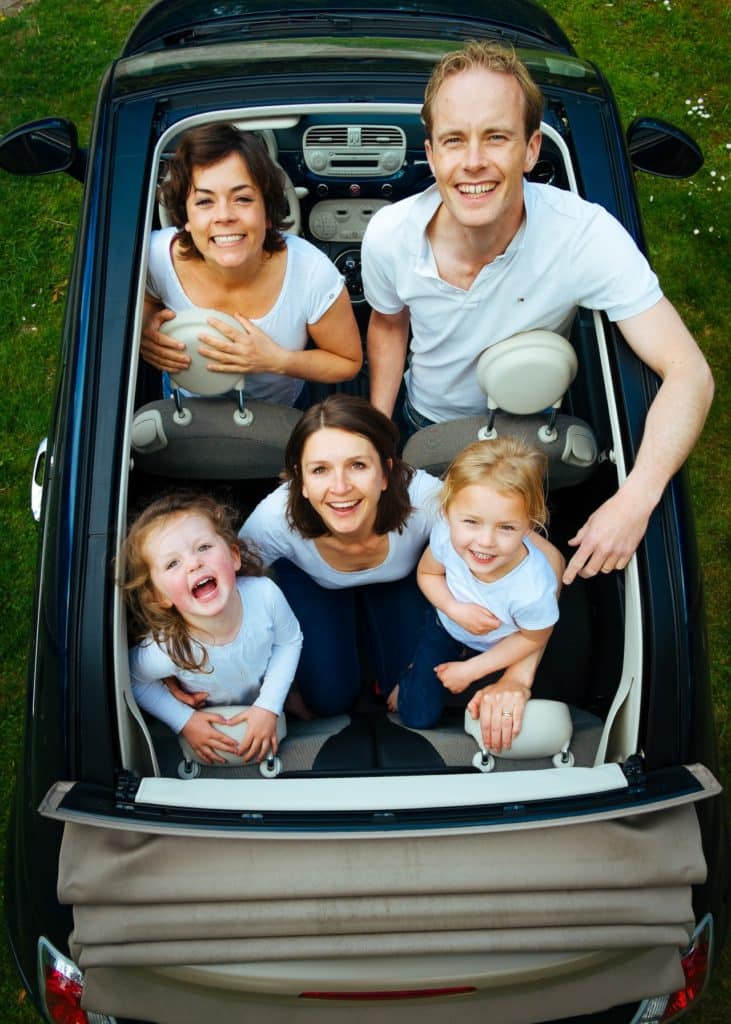 people looking out of a sunroof
