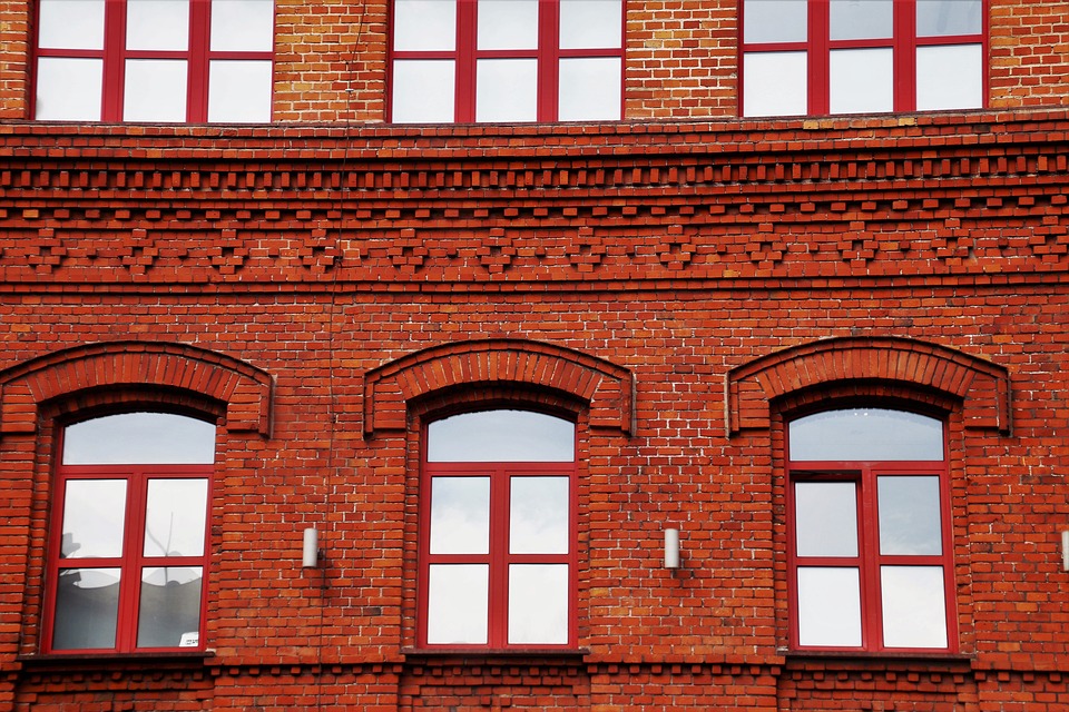 Red brick building with red windows.