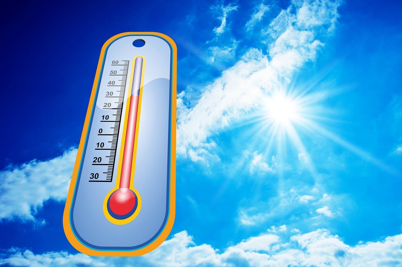 Temperature gauge in a blue sky.