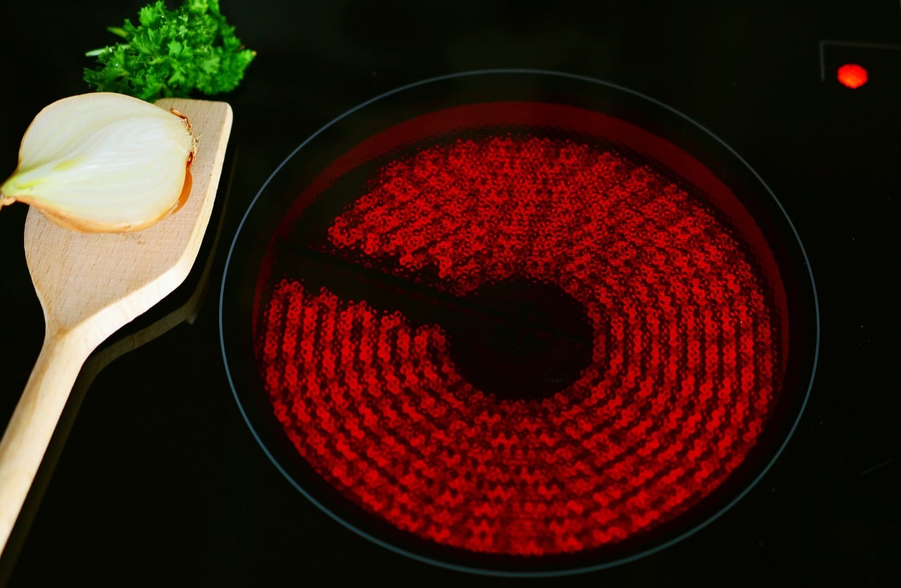 A glowing red ceramic stove coil.