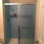 A glass bypass shower door.