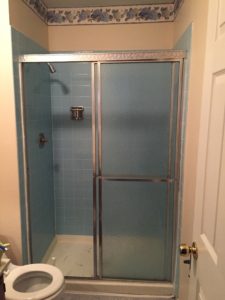 A glass bypass shower door.