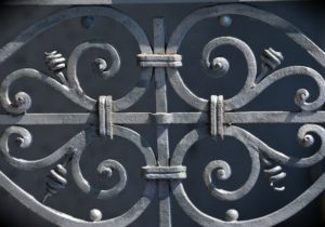 Light gray curled iron railing.
