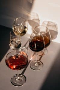 types of wine glasses sitting on a white table