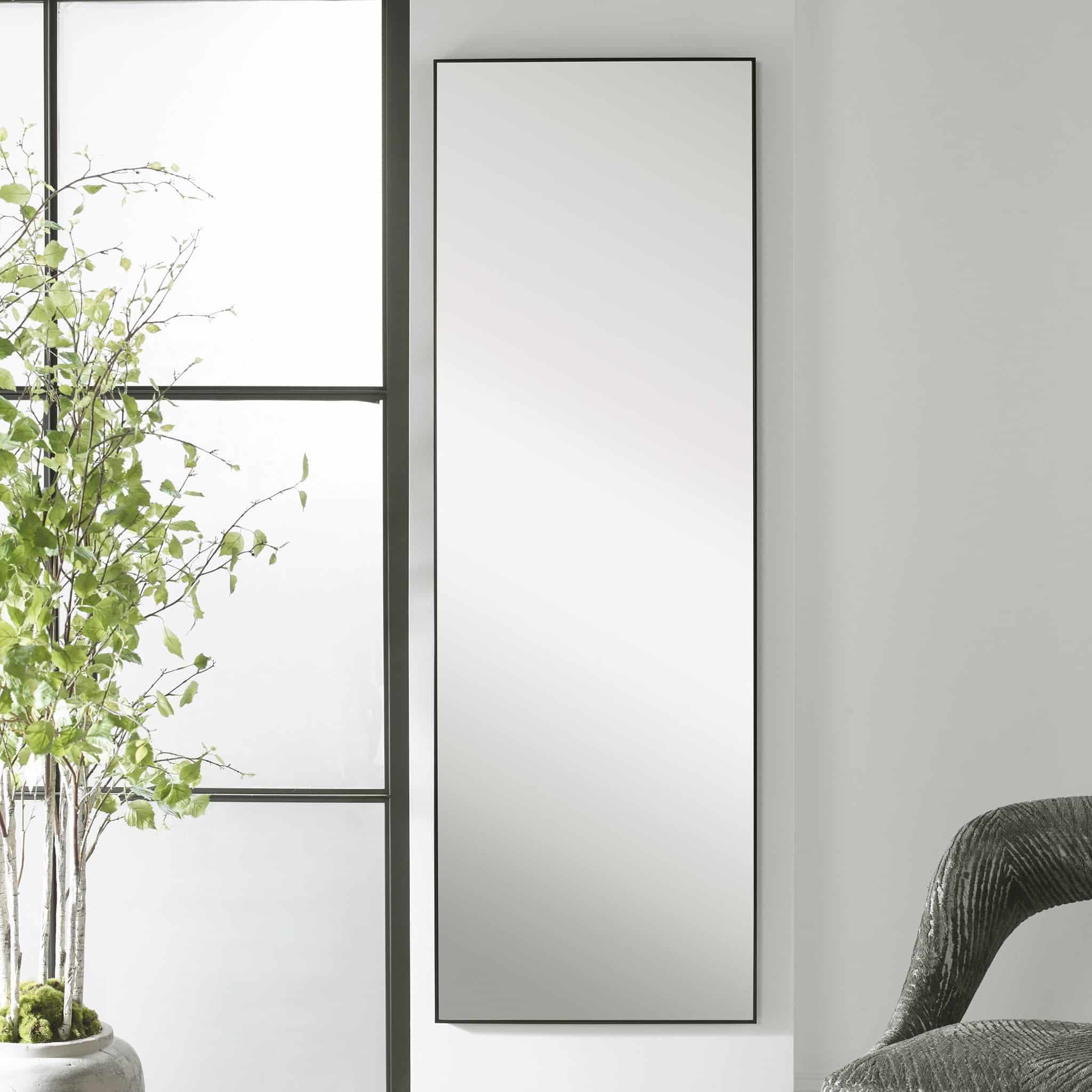 Lancaster Full Floor Length Black Framed Mirror hanging on a white wall