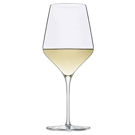 Libbey White Wine Glass against a white background and white wine in the glass